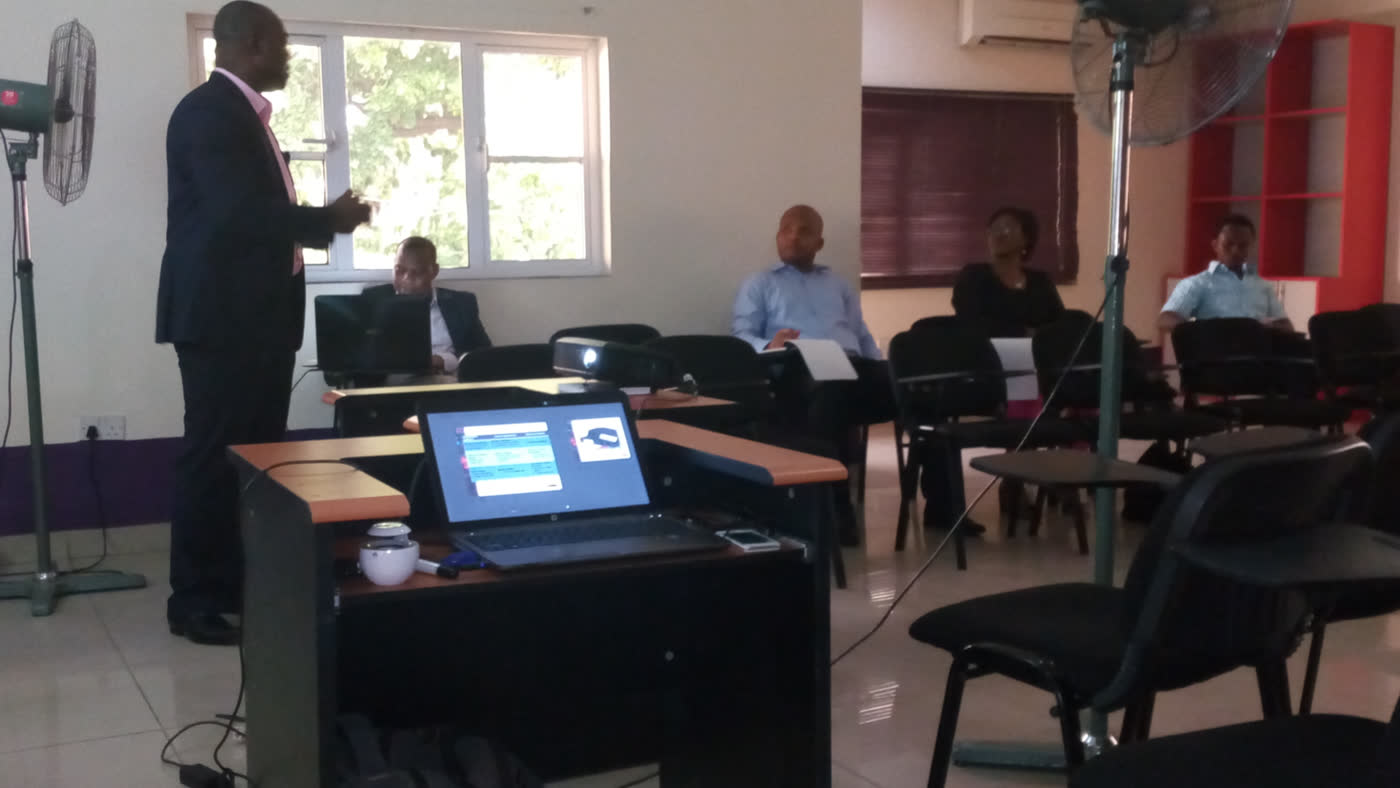 Training facilitator presenting HR content to participants in a Lagos classroom